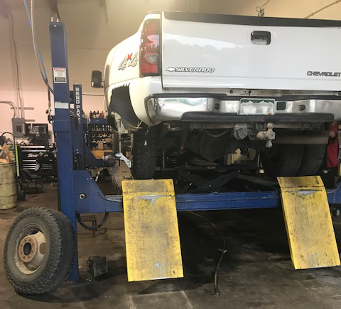 Truck in shop on lift